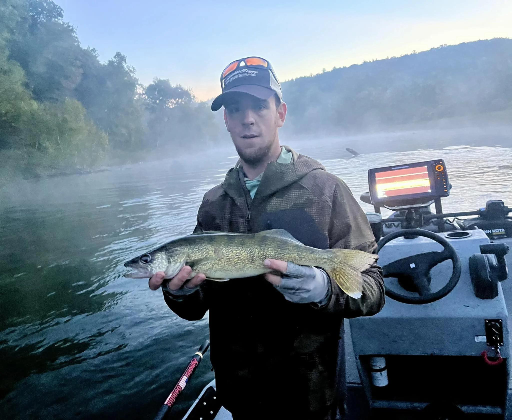 Maine Fishing Guide Brandon Bichrest with a Walleye caught on his first cast with new jet boat, caught in Michigan sept 2024