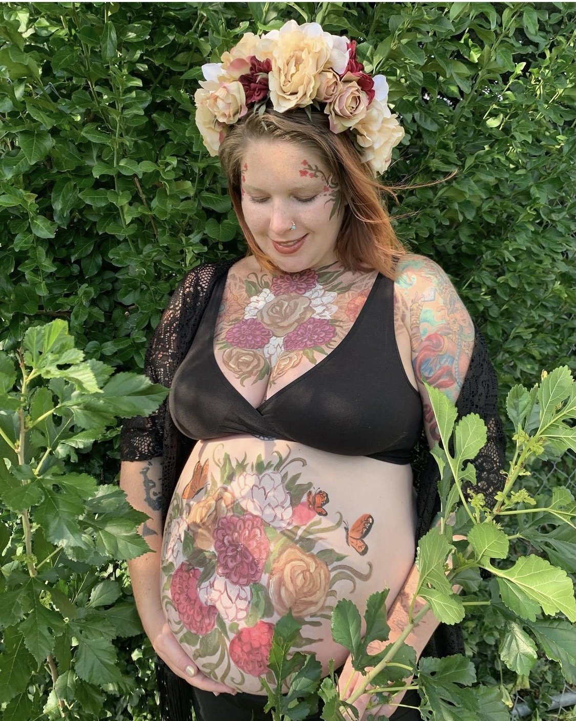 Maternity body painting by Nicole Palapoli: floral belly painting with a flower crown