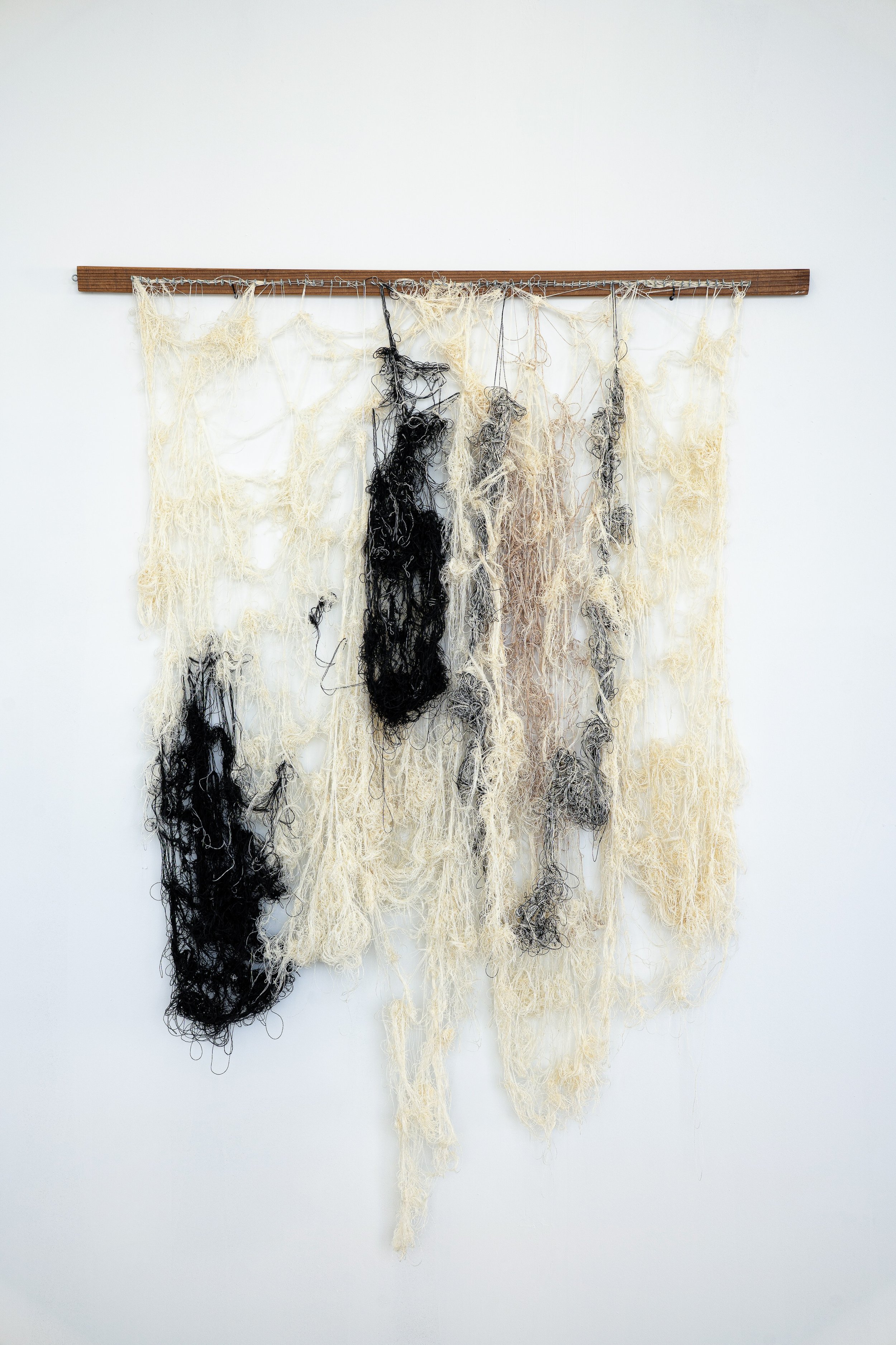 Hanging Warp, 2025, Yarn, loom rattle.