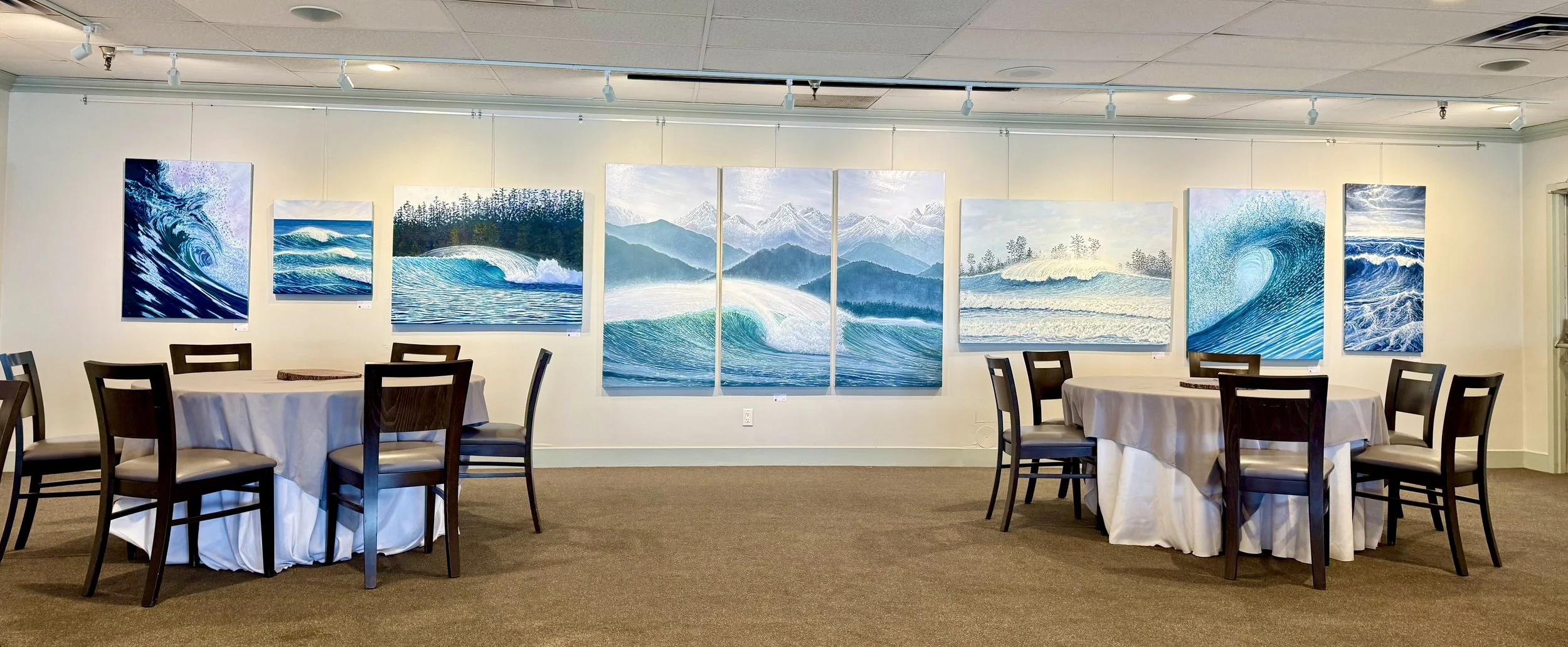 Original ocean paintings displayed in the dining room at Bayside Resort in Parksville, BC by Emma Paveley