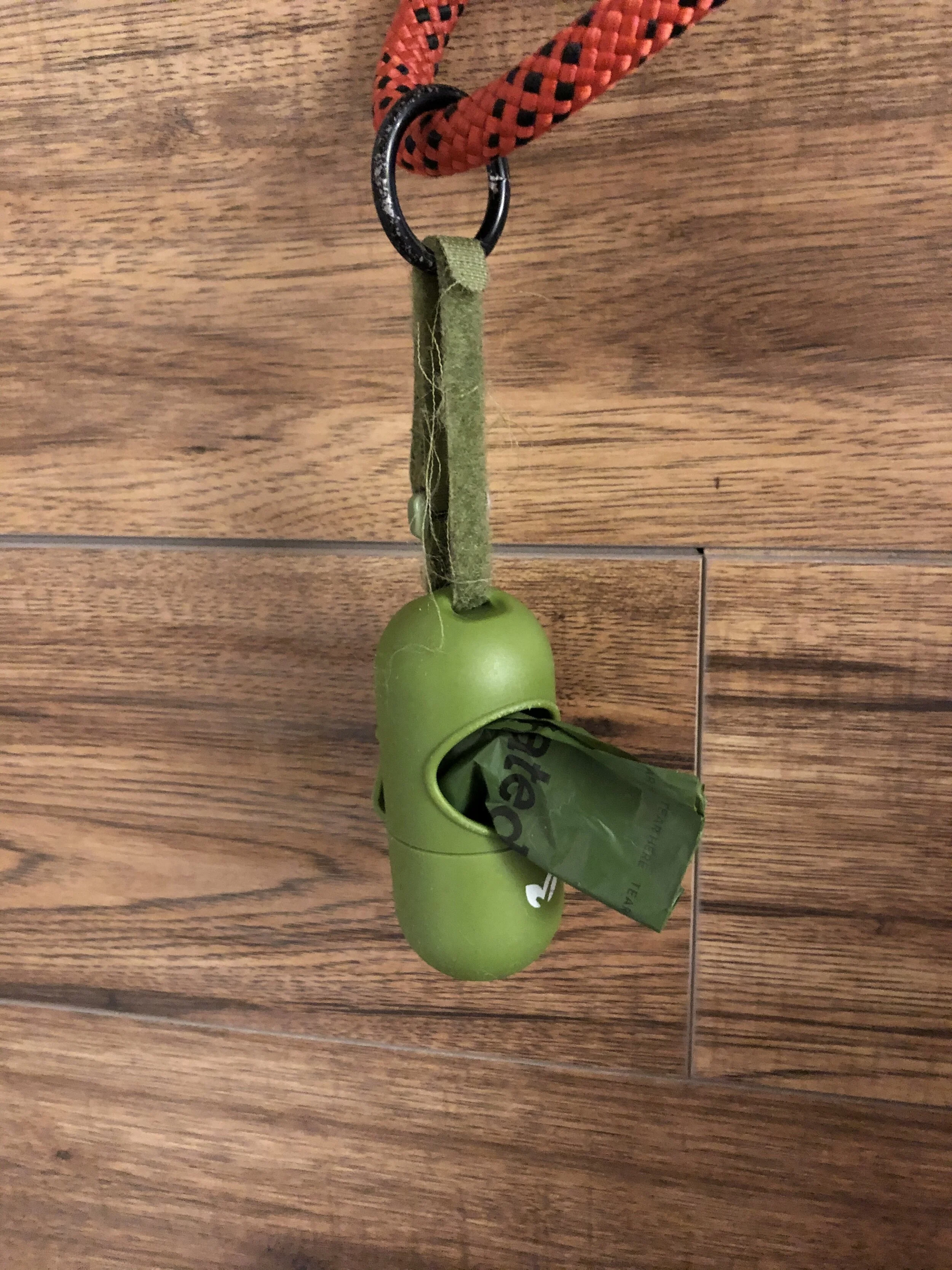 The Earth Rated Dog Poop Bag dispenser attaches with Velcro onto the leash