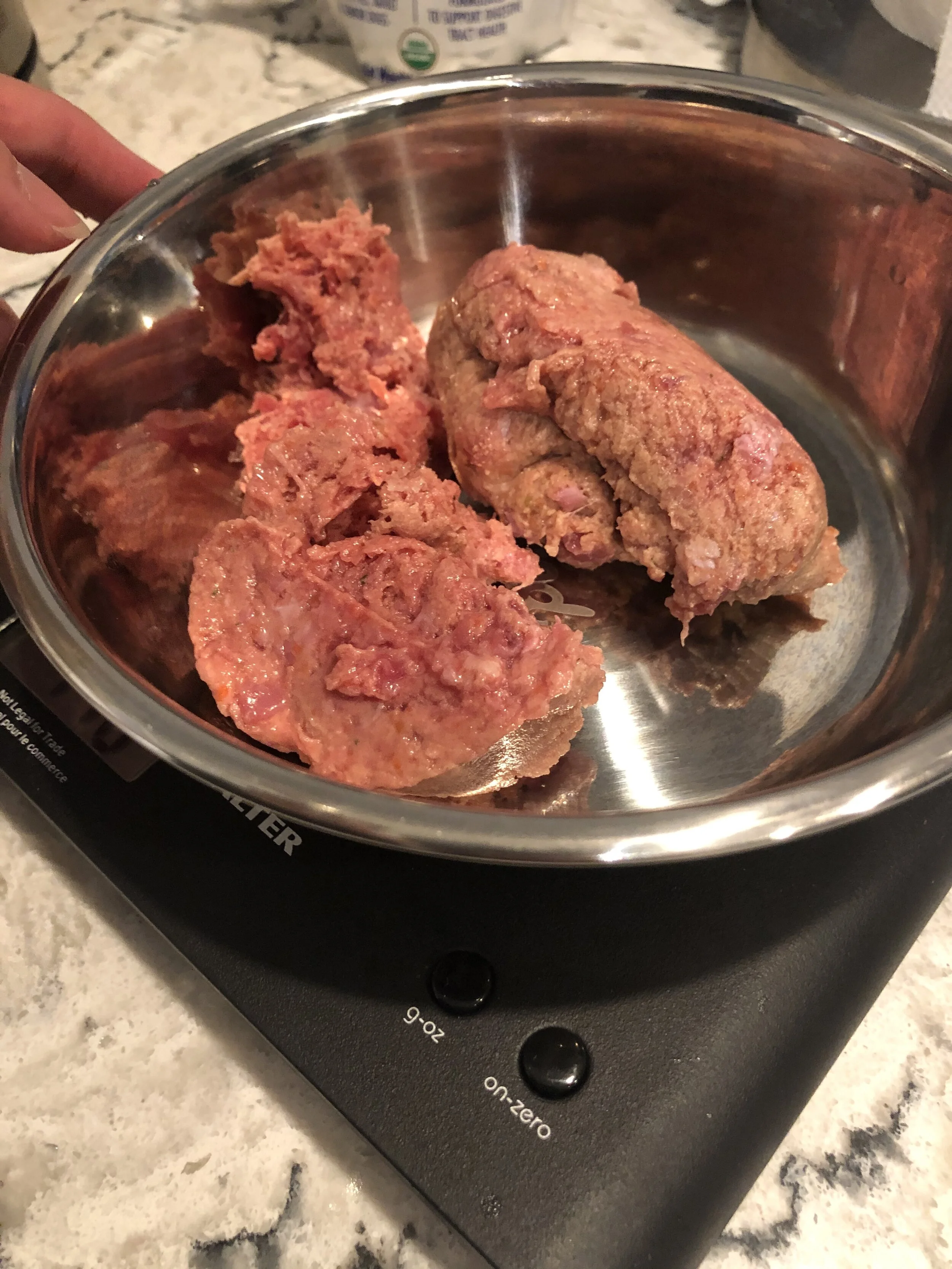 Markus’ raw chicken, bone and vegetables from  CRUDO  being weighed on a scale