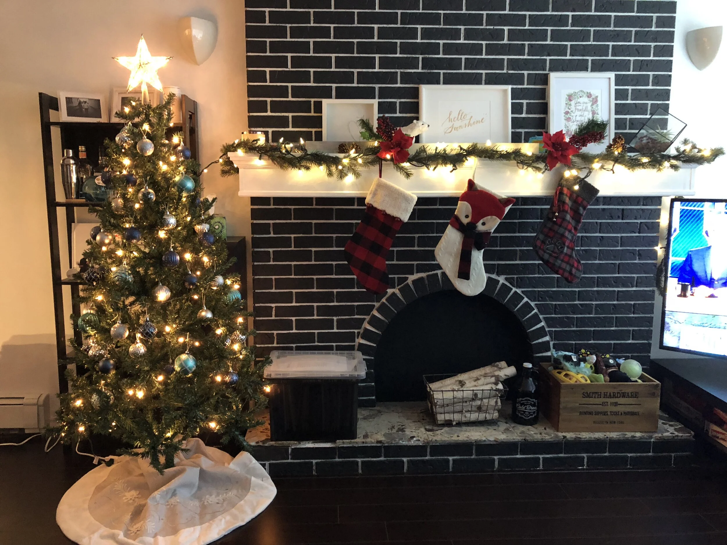 Our Christmas tree with Markus’ stocking (right) hanging above his toy chest