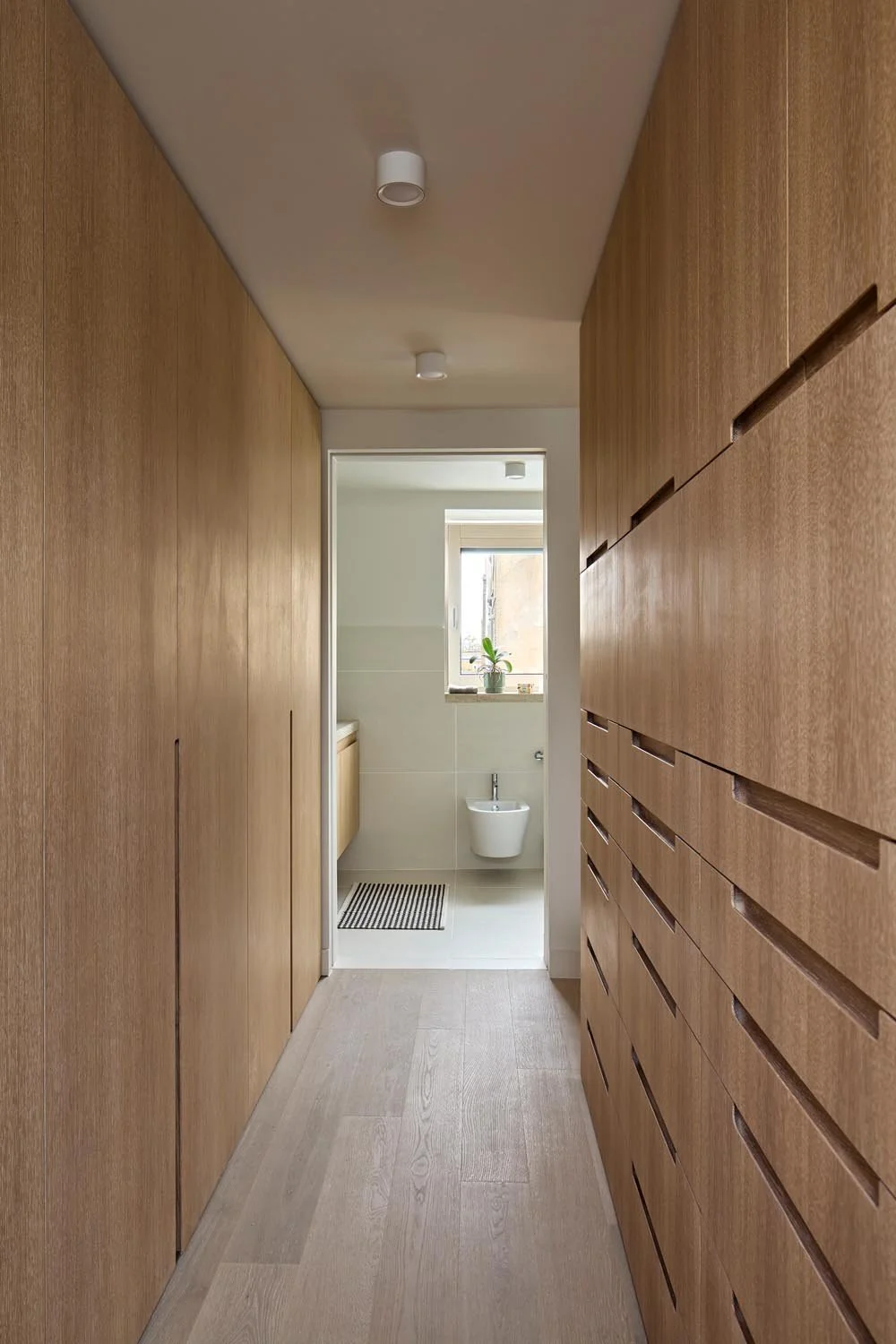 Integrated timber joinery and storage in the Lower Clapton House loft extension and family home retrofit.