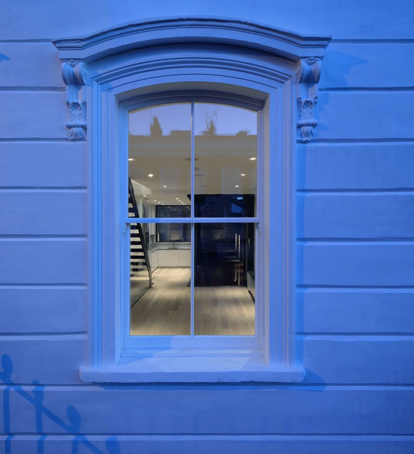 Front elevation of a Victorian terrace in Islington, with traditional sash windows retained within a conservation area.