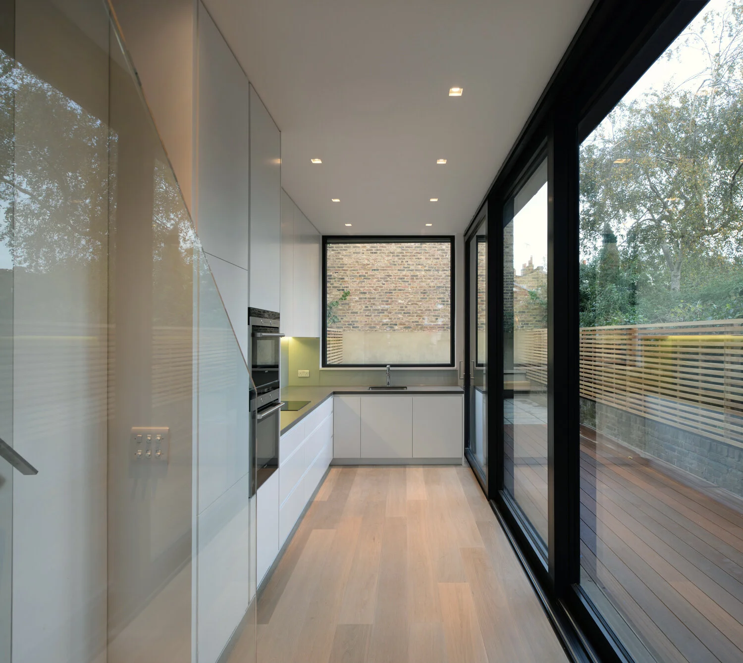 Rear extension to a Victorian terrace, creating a direct visual and physical connection between kitchen, dining space and garden.