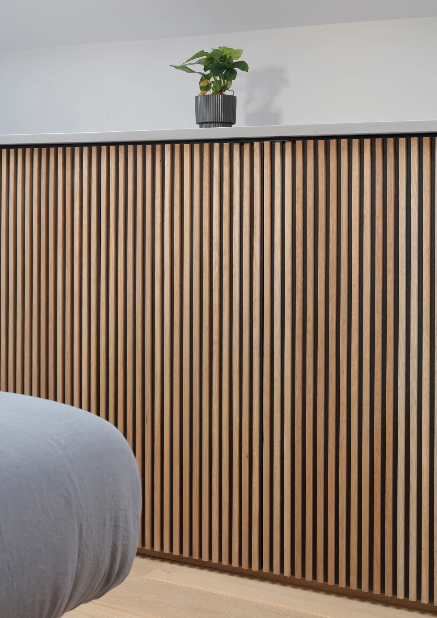 Bespoke timber joinery within a Victorian terrace loft extension, shown closed as a calm bedroom elevation.