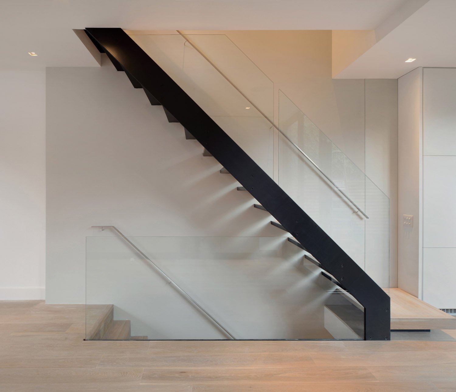 New straight-run stair replacing the original dog-leg stair, reorganising circulation through a Victorian terrace.