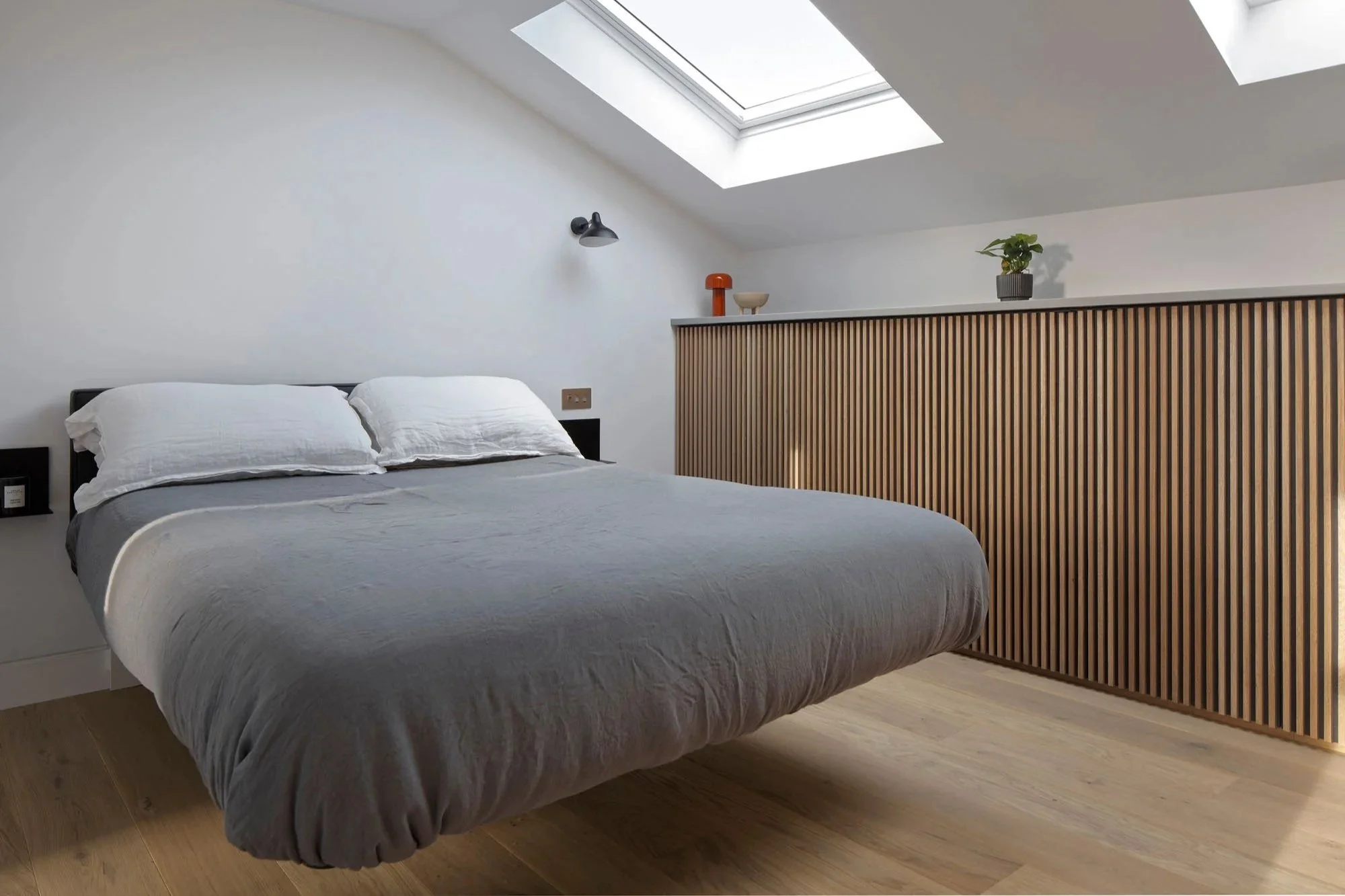 Master bedroom within a Victorian terrace loft extension in Islington, designed as part of a phased whole-house reworking.