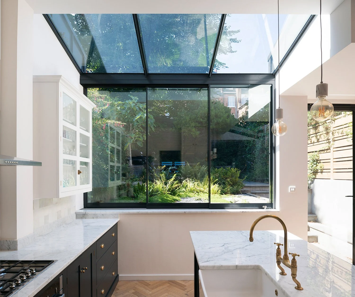 Cantilevered garden room extension showing bespoke structure glazing and landscape connection