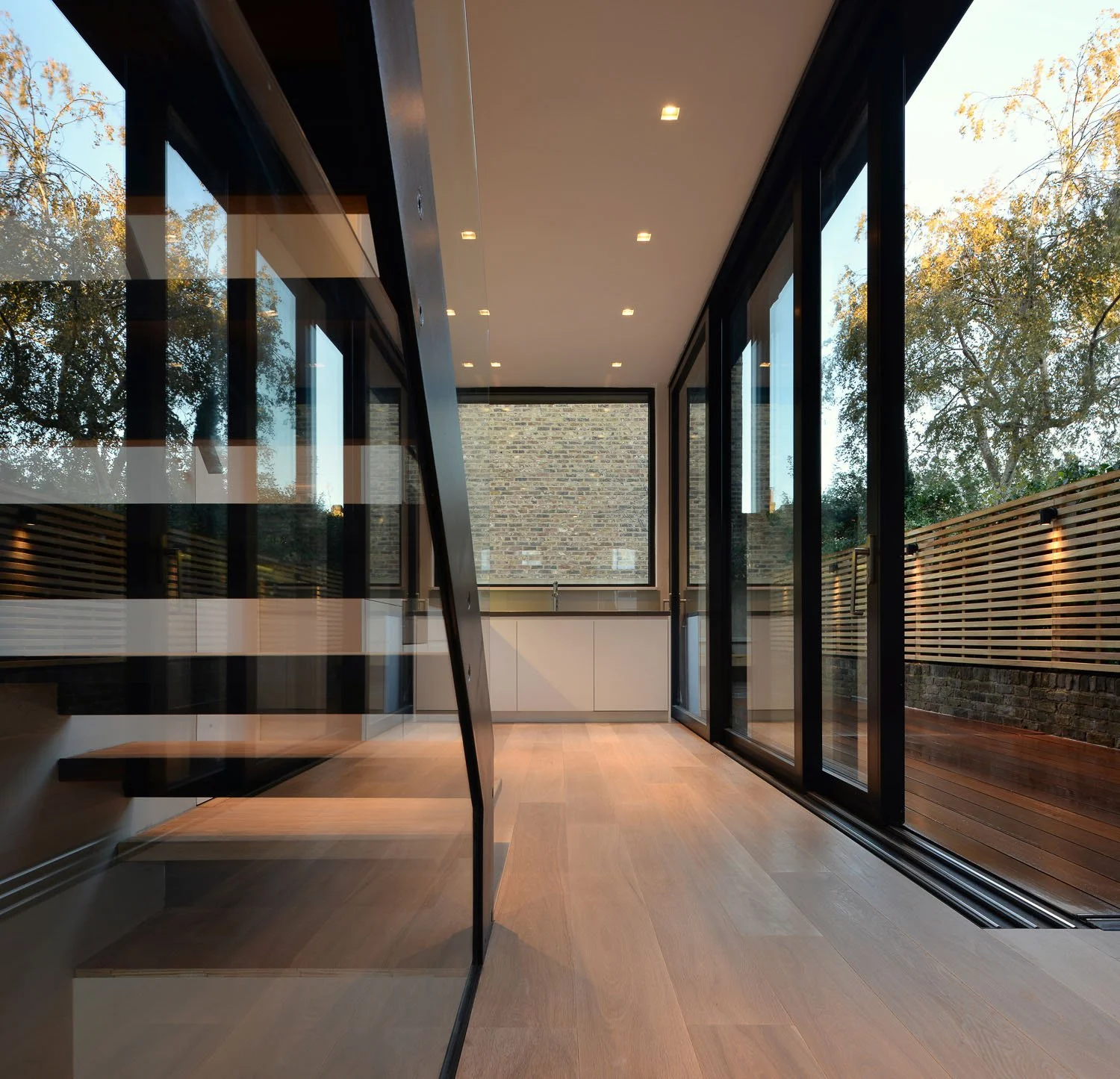 Rear extension to a Victorian terrace in Islington, with a new straight-run stair organising the house and connecting the kitchen to the garden.