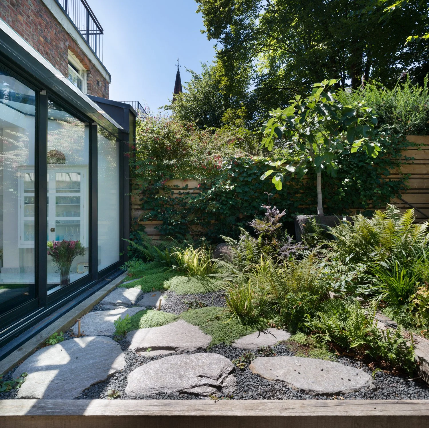 Landscaped garden and rear extension at Gladsmuir Road, reconnecting a Victorian Islington terrace with its garden.