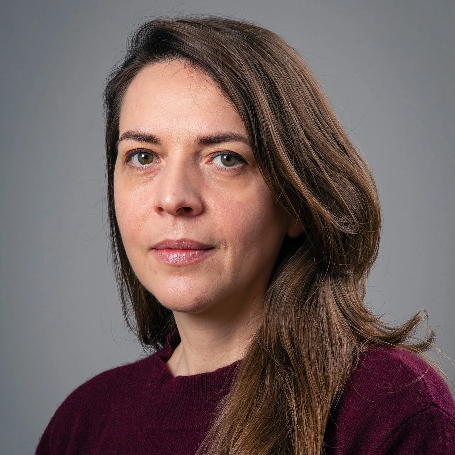 Daniela Ciarcelluti, co-founder of Studio CMA, portrait against a soft grey background.