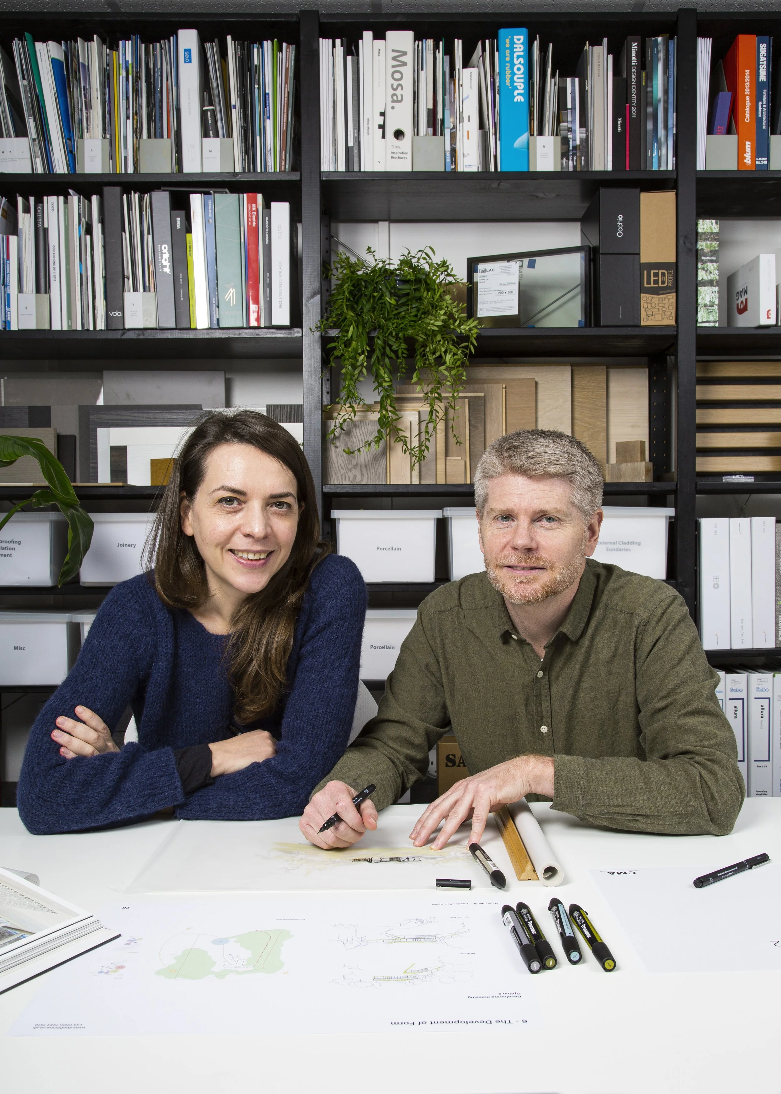 Greg Mathers and Daniela Ciarcelluti of Studio CMA in their London architecture studio, surrounded by material samples and design references.