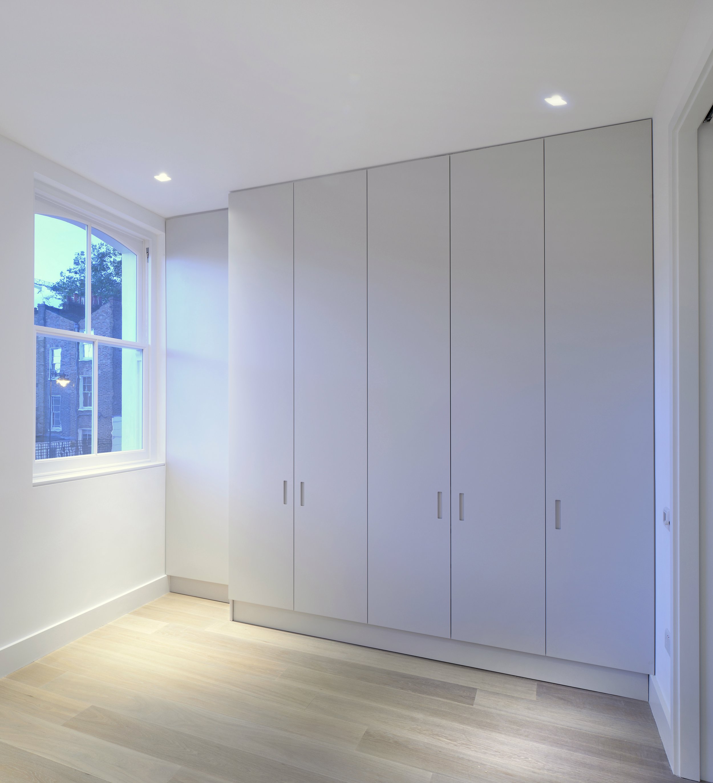 Integrated storage and joinery formed as part of the basement extension and whole-house reorganisation.