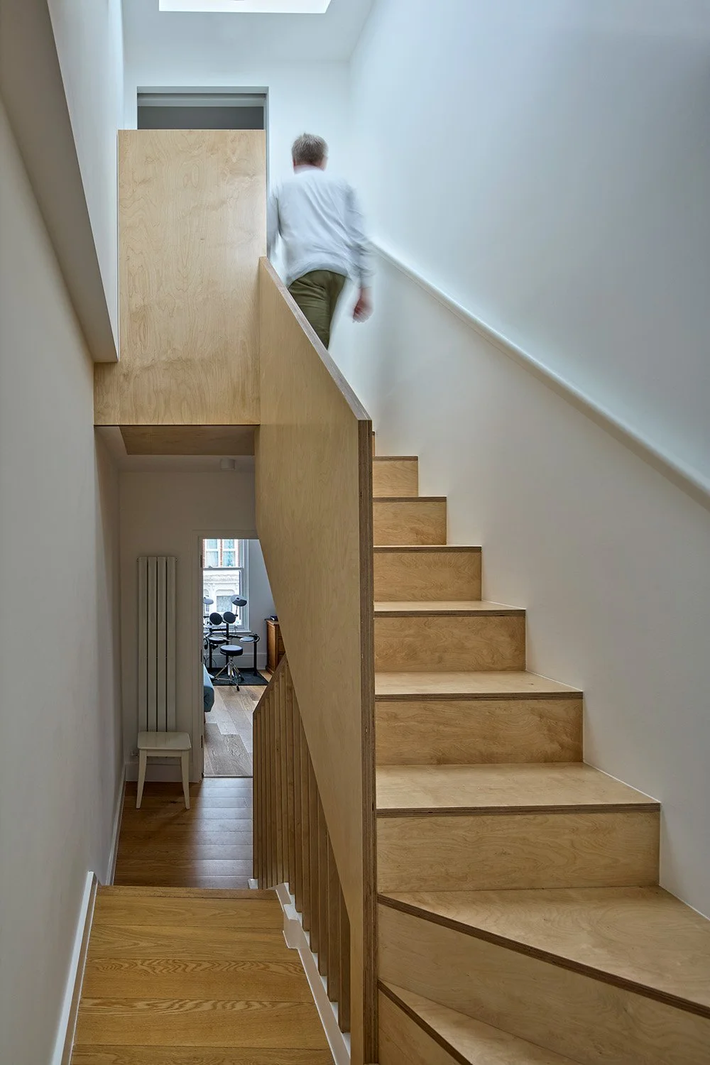 Timber staircase in a Victorian London home renovation showing clean lines and natural light