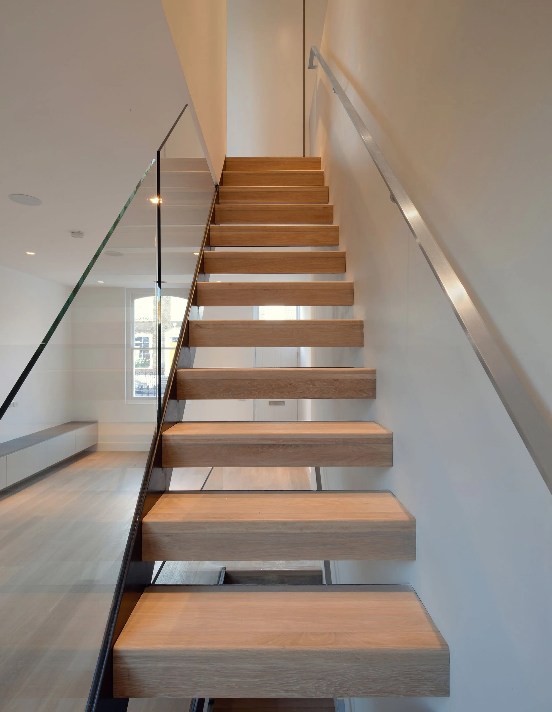 New straight-run stair replacing the original dog-leg stair, reorganising circulation through a Victorian terrace.
