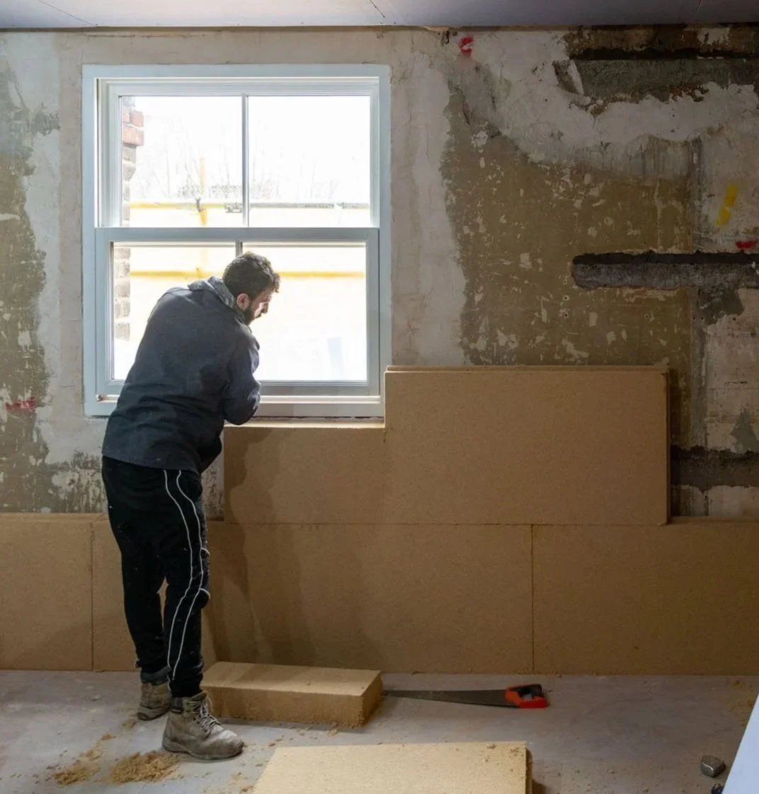 Internal wall insulation installed around a window reveal during a London period home retrofit.