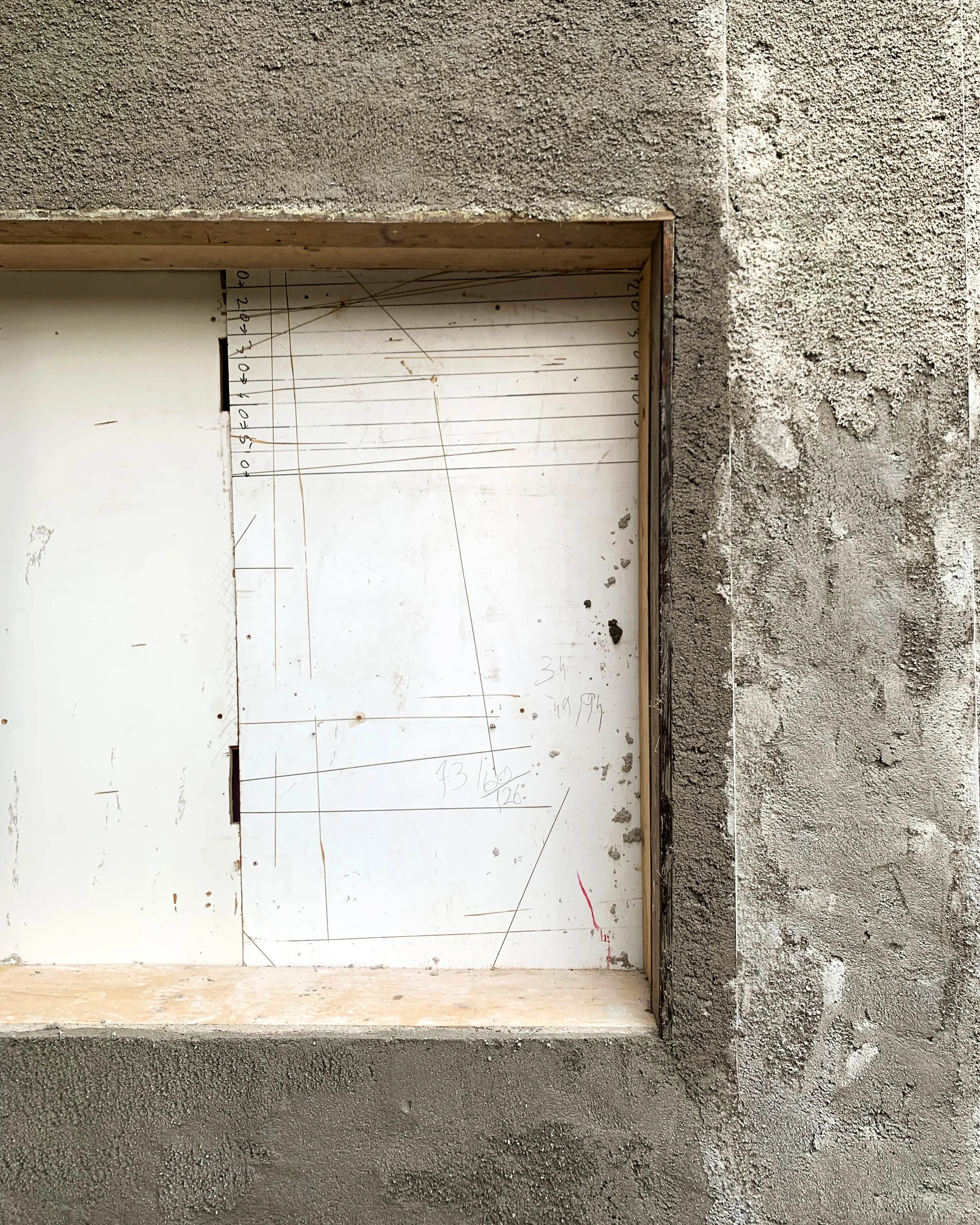 Cork insulation detail around a window reveal during a breathable retrofit