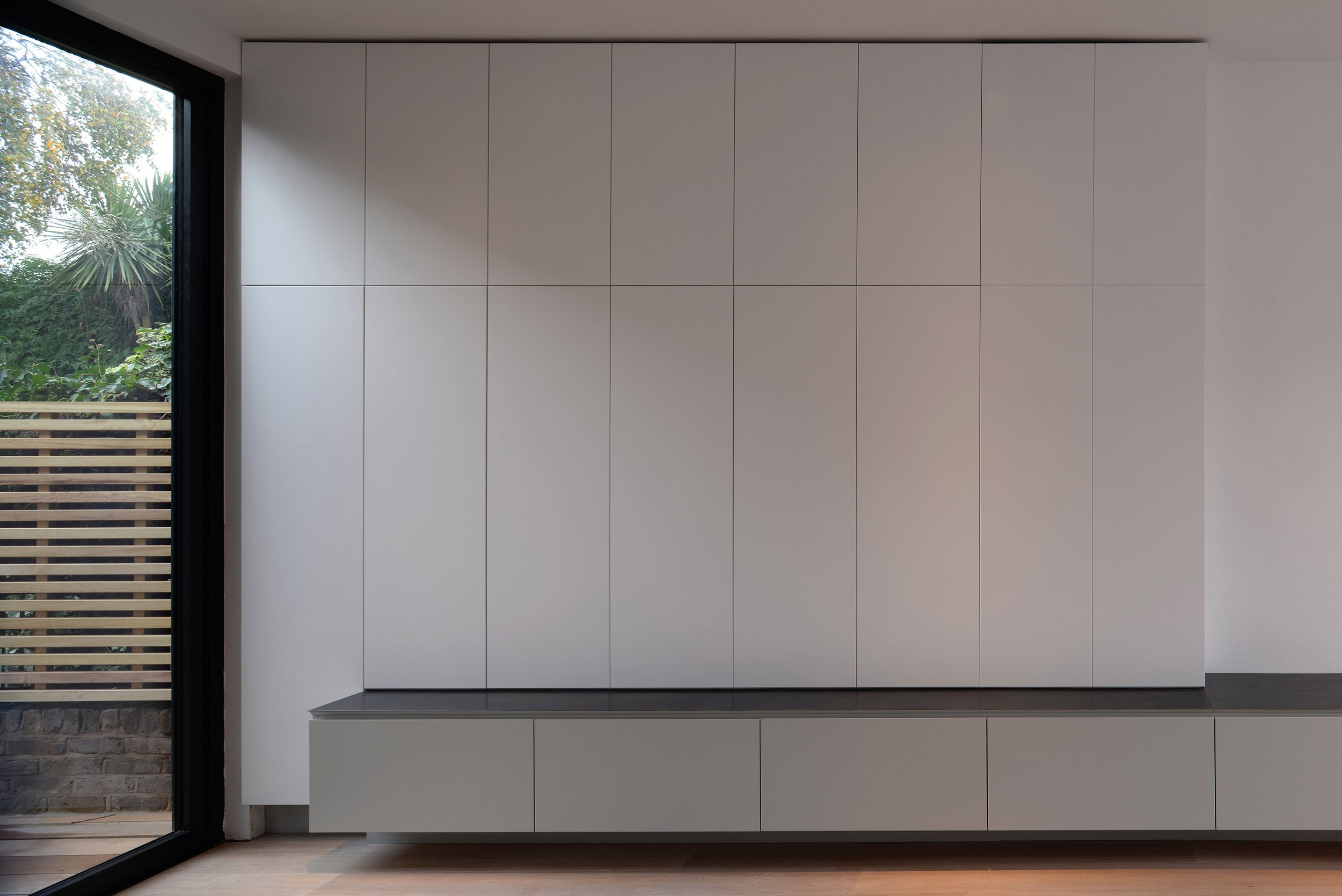 Integrated storage and joinery formed as part of the basement extension and whole-house reorganisation.