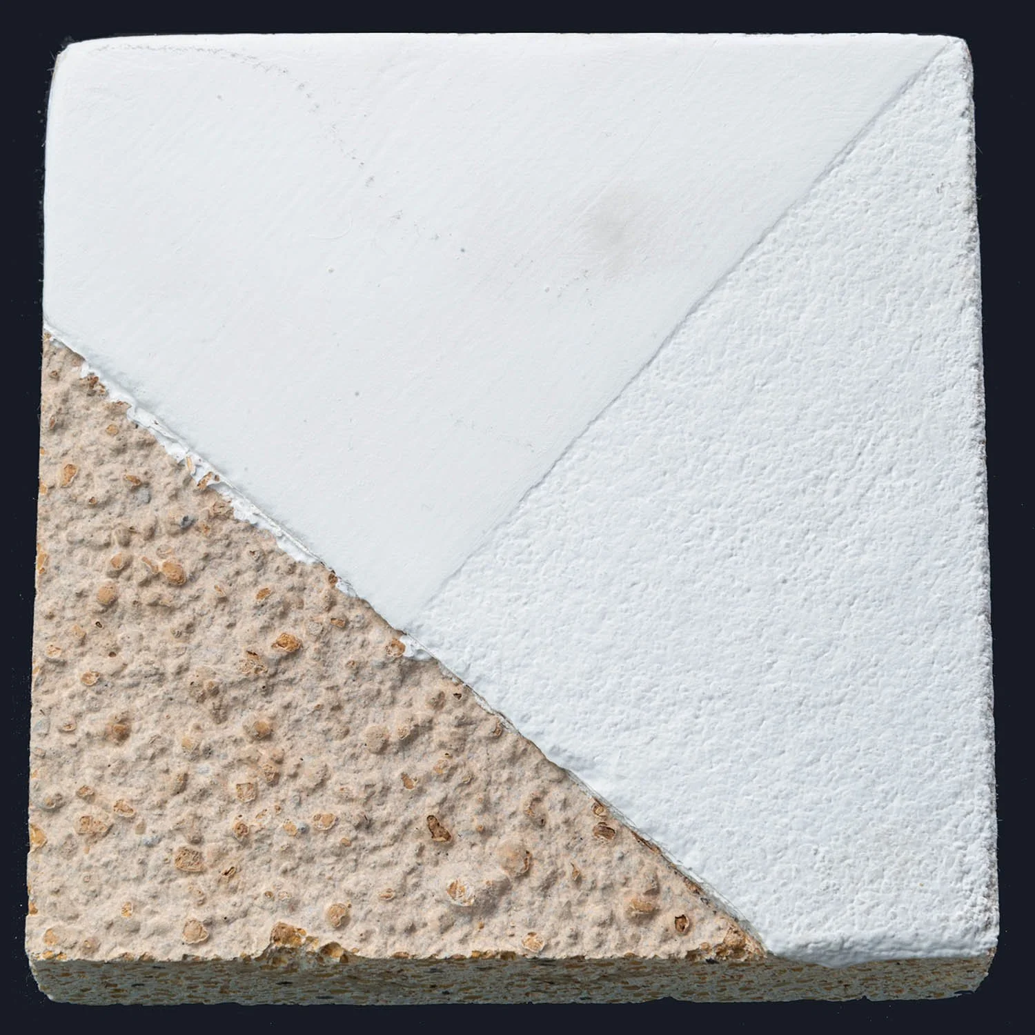 Close-up of lime plaster showing breathable natural wall finish texture