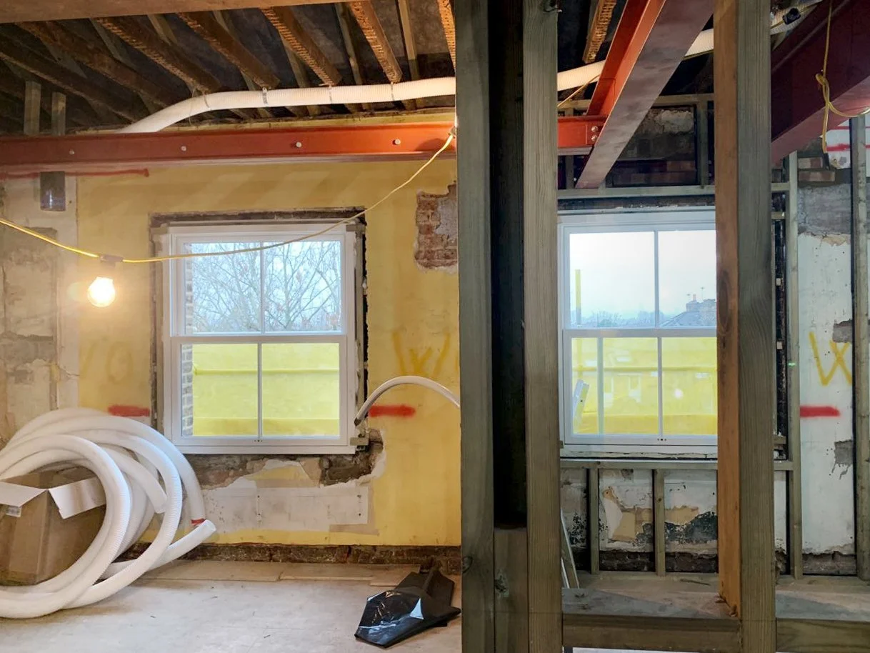 MVHR ductwork routed through an exposed ceiling during the retrofit of a London period home