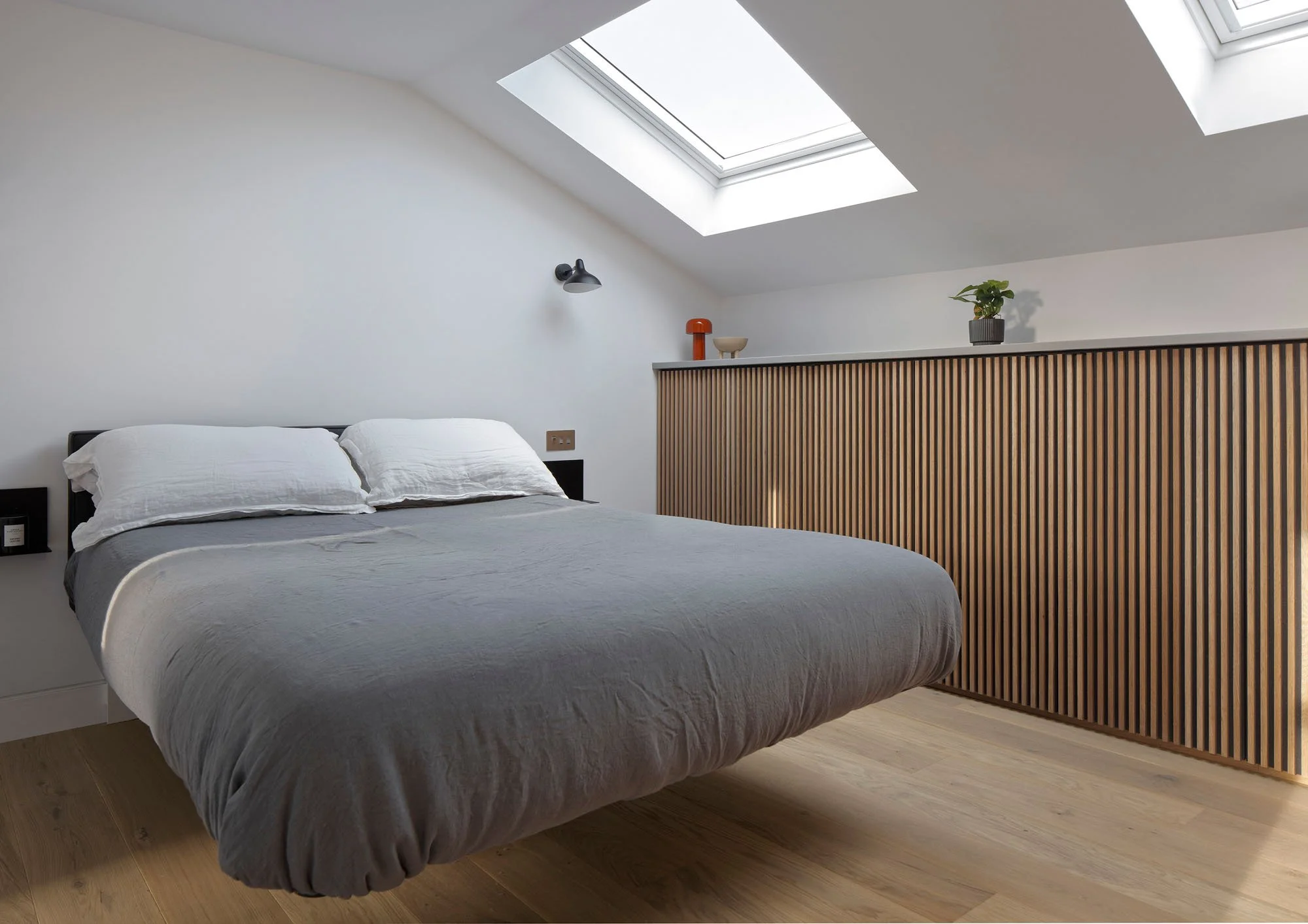 Open-plan interior of a Victorian London home retrofit with rooflight and timber detailing