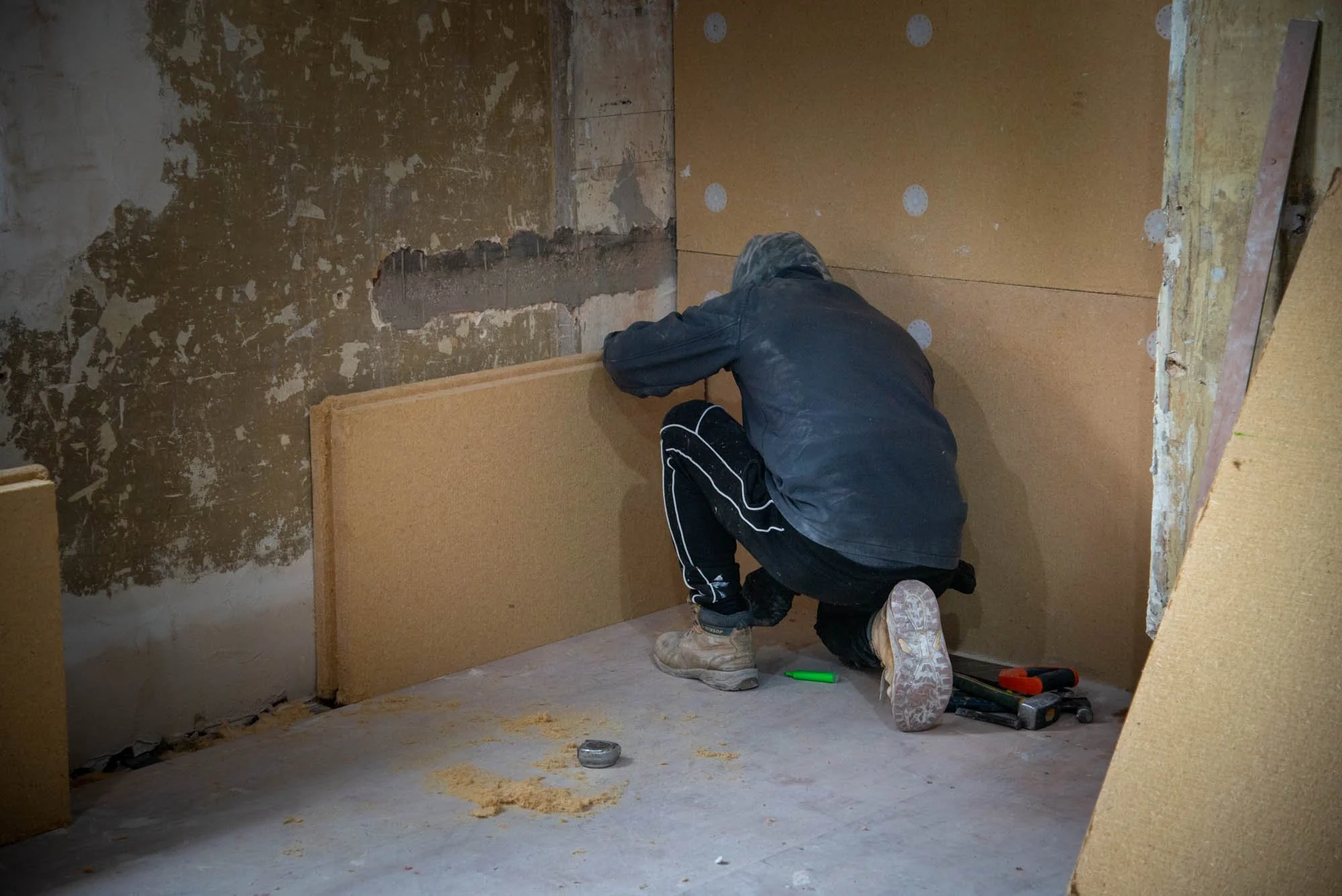 Wood fibre internal wall insulation being installed as part of the Ashley Road retrofit by Studio CMA.