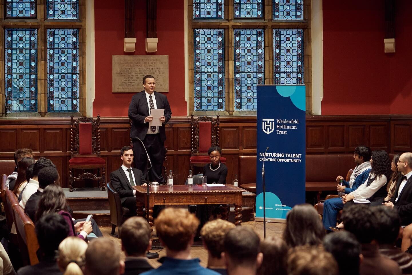 The WHT Annual Debate Annual Debate 2024 took place on 13th March 2024 in the historic chamber of the Oxford Union. With an audience of over 200, scholars debated the topic &quot;The House believes that individuals should bear responsibility for thei