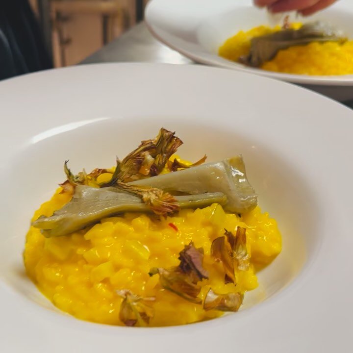 This beautiful golden bowl is a feast for your eyes and pure comfort for your taste buds, Saffron Risotto with Artichoke &amp; Grana Padano &mdash; slow-stirred saffron risotto, crowned with soft artichokes and curls of Grana Padano. Rich, fragrant, 