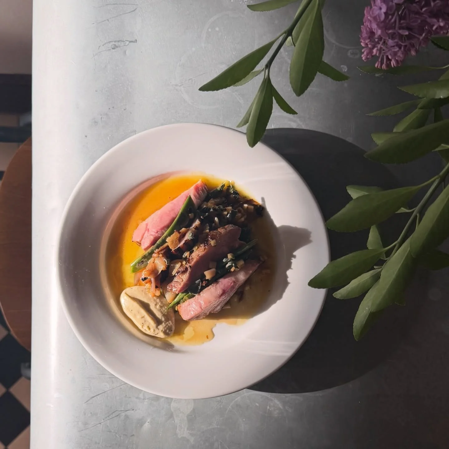 This absolutely beautiful plate from our babe @lunchbaron has flown off the pass this weekend - Grilled Koji Pork Collar tender and blush served with Piattone Beans, Pickled Apple &amp; Anchovy and some tasty little crunchy Scrunions. We love it so m