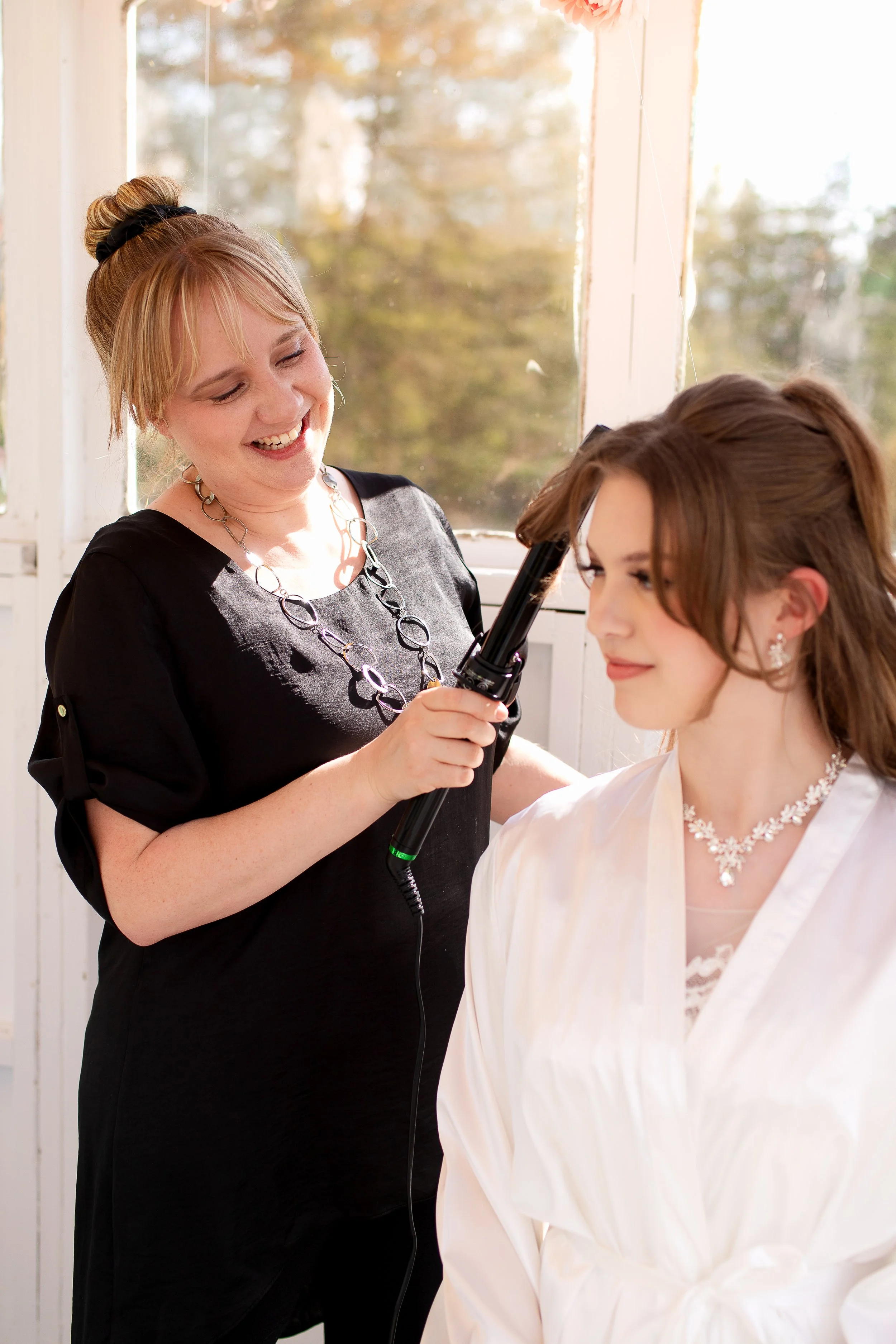 hairstylist doing bridal hair