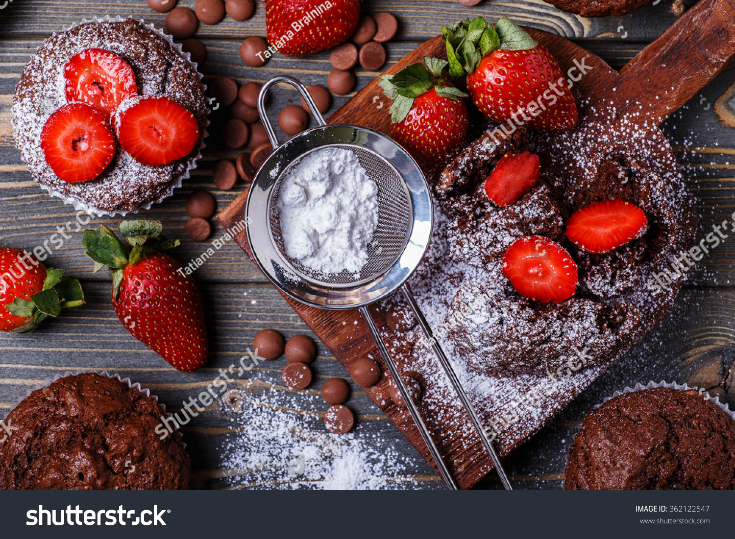 stock-photo-chocolate-muffins-with-strawberry-on-dark-background-selective-focus-362122547.jpg