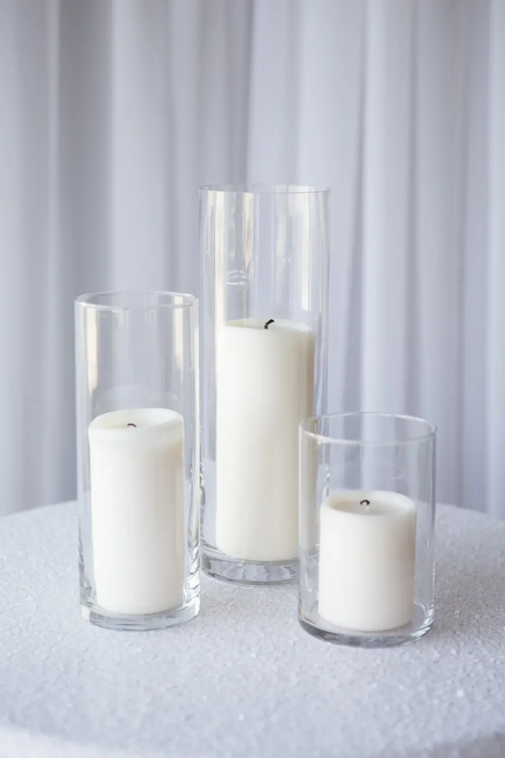Glass cylindar trio with
pillar candles