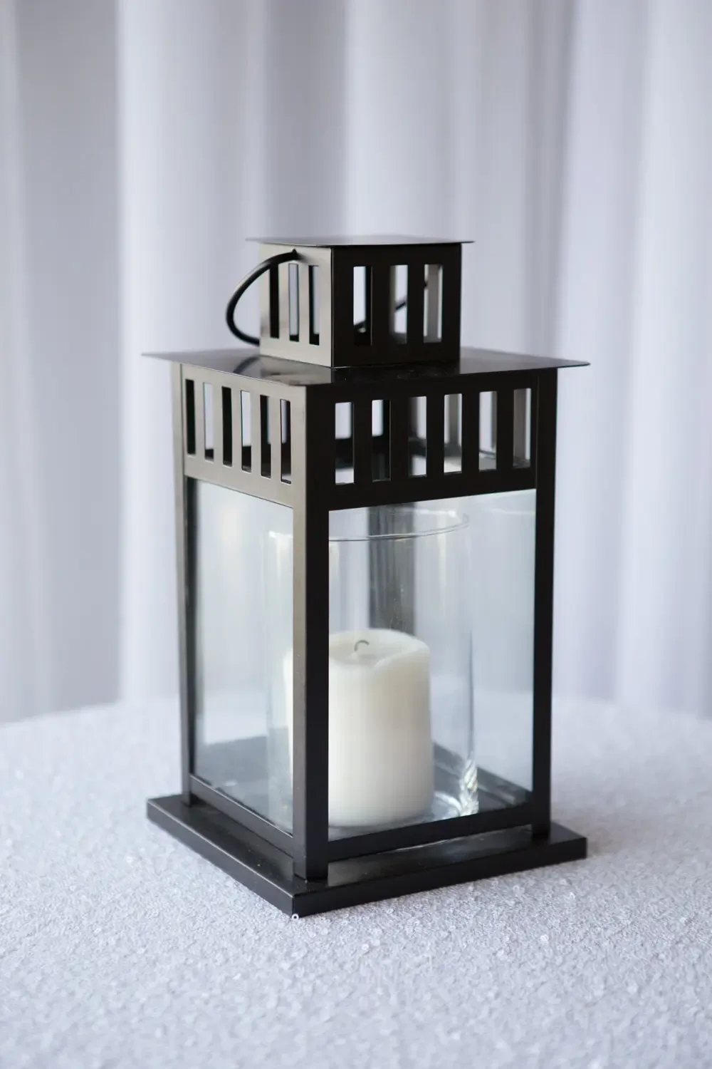 Black lantern with
cylinder and ivory candle