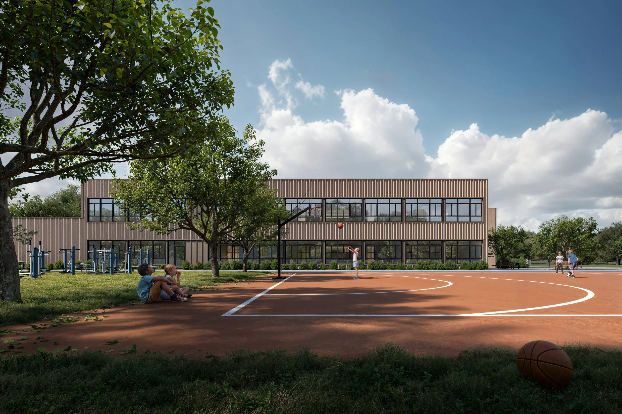 Children playing basketball on an outdoor court with a school building in the background, trees, and a basketball nearby.