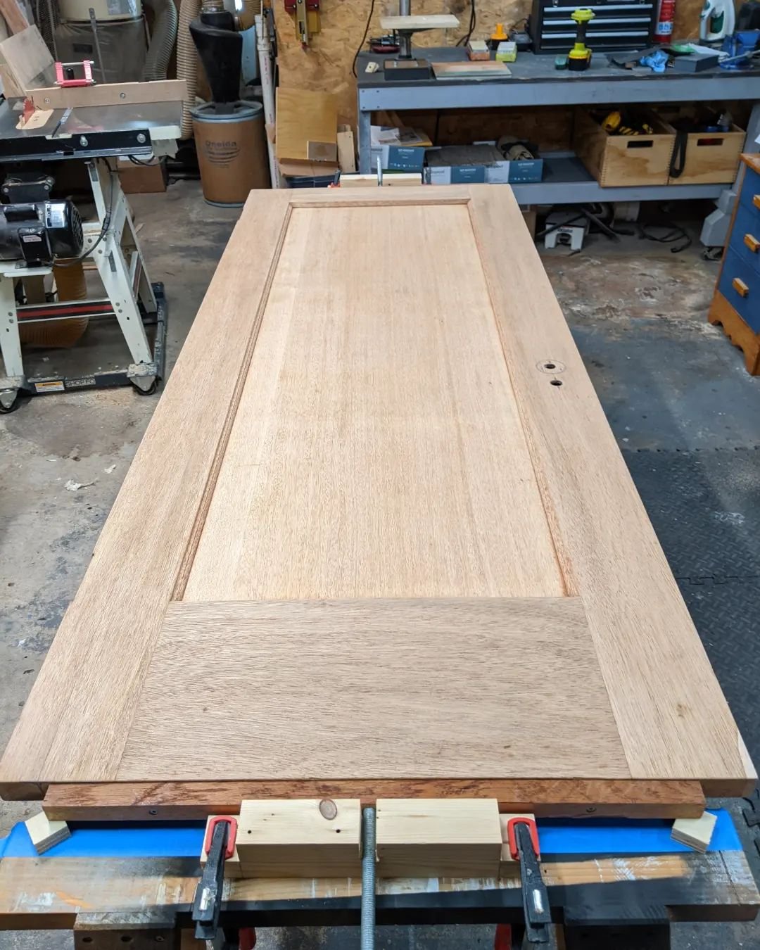 Stripped and sanded. A few minor repairs. The veneer patch will get colored to match. And my improvised method for flipping the door while applying finish to each side without touching the finished surfaces. 

#furniturerestoration #doorrestoration  
