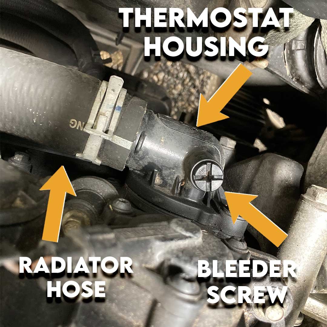Thermostat housing bleeder screw on a Dodge Journey