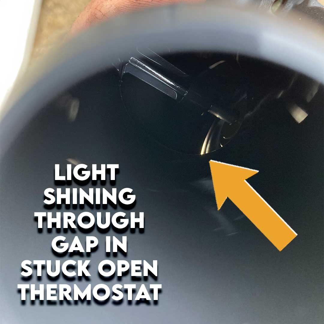 Light shining through gap in stuck open thermostat on a Dodge Journey