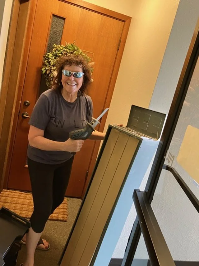 Maui Group volunteer Janice Marsters prepares map storage boxes to help archive the group's map collection.