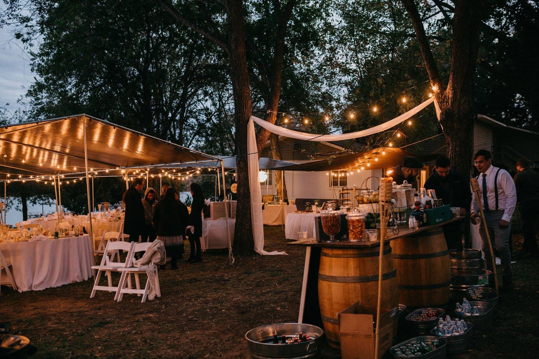 Wedding reception at night lit beautifully with overhead lights