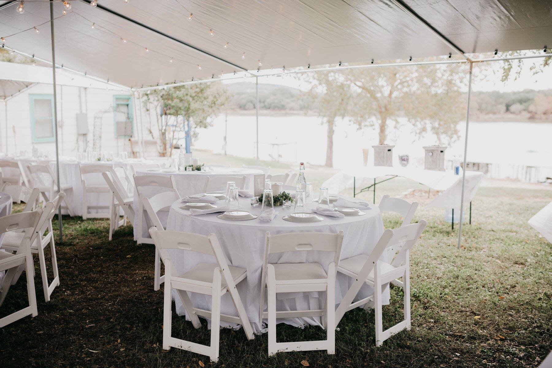 Wedding reception tables under a large covering