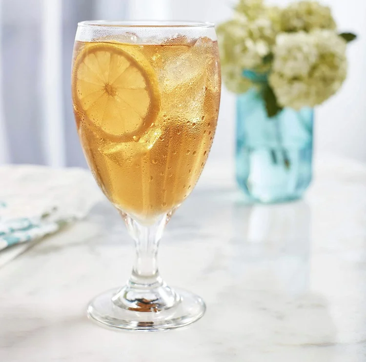 Water goblet shown with an iced beverage.