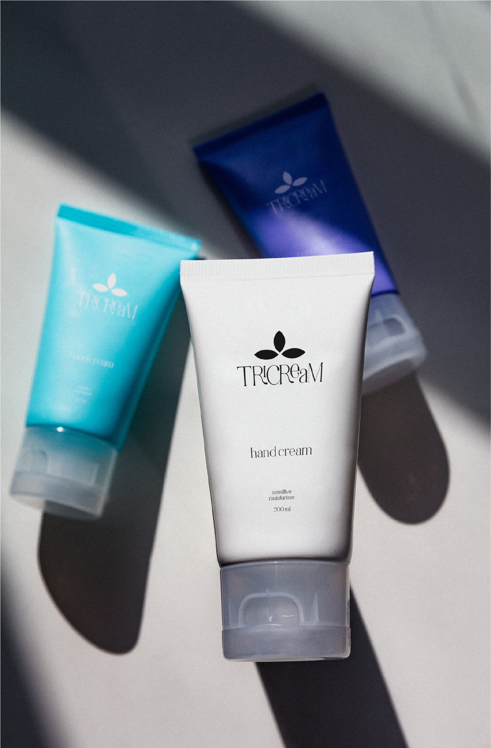tricream brand purple, blue white packaging design 