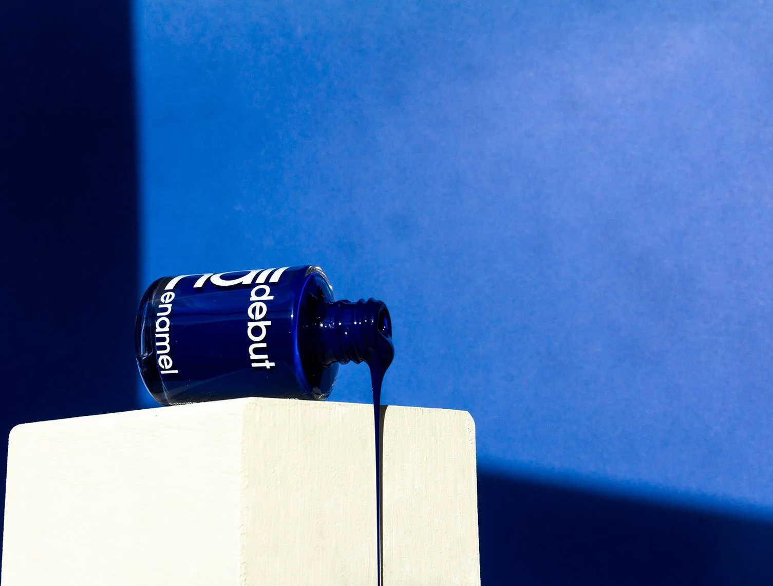 Blue nail color with white botton in blue background 