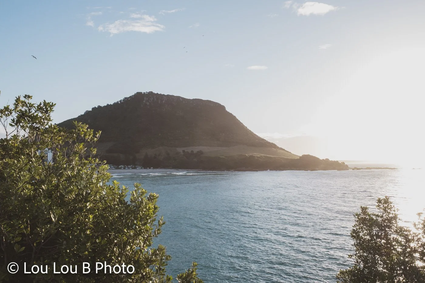 Mauao viewed across the ocean from Leisure Island in soft morning light from Mount Maunganui