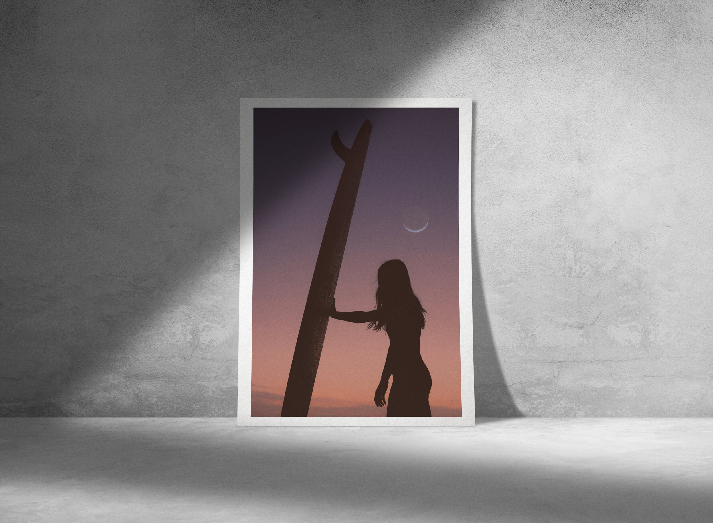 Silhouette of a female surfer with her board, under a crescent moon. Breathtaking fine art photographic print, capturing the beauty of surfing.