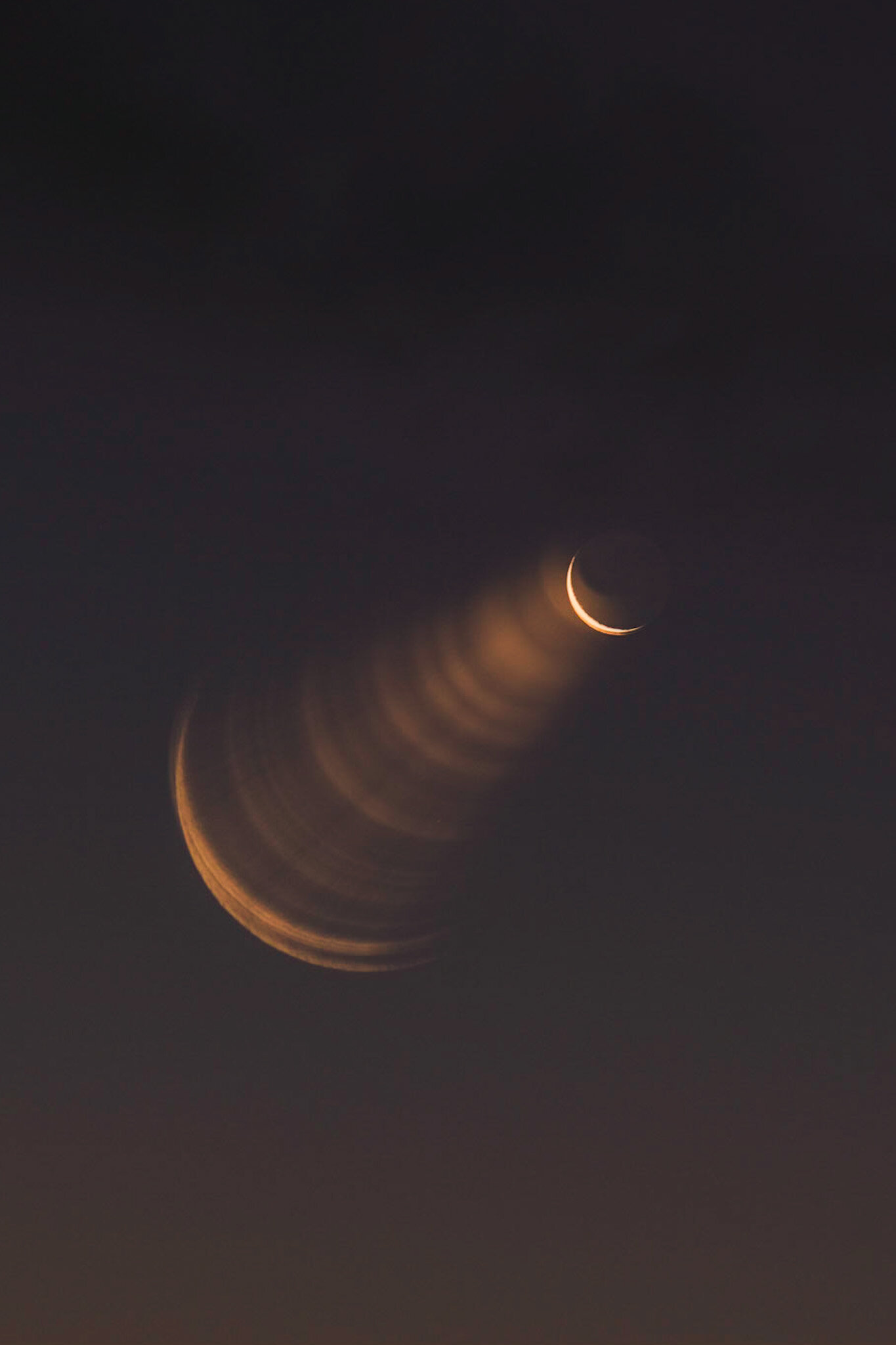 Unique photo of the crescent moon with crescents radiating from the center point. A mesmerizing and mysterious astronomical capture.