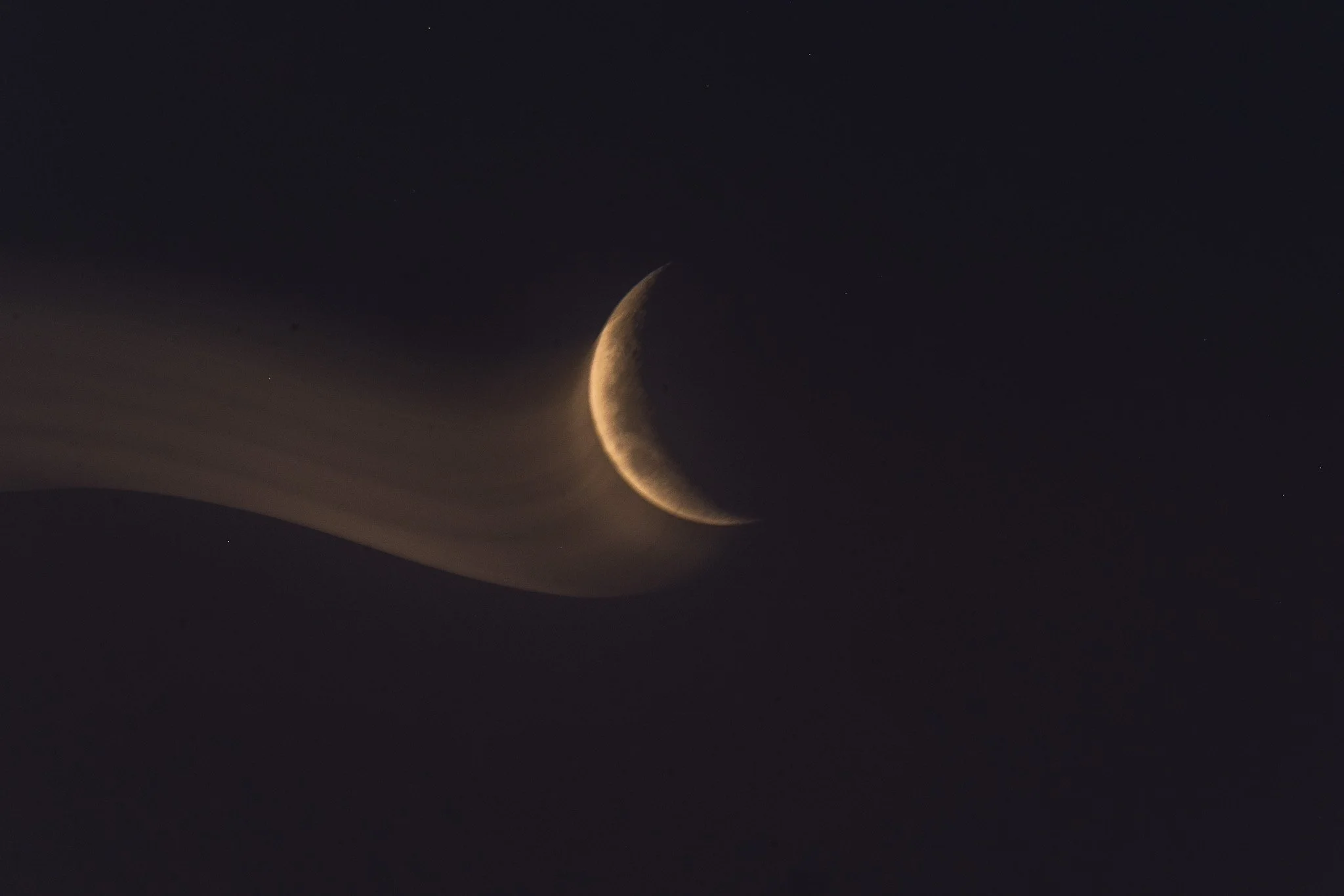 Immerse yourself in the captivating beauty of this abstract crescent moon photo by Lou Lou B Photo. The golden crescent moon shines bright against the rich dark blue background, leaving a trail of mesmerizing light behind. A stunning and unique depic