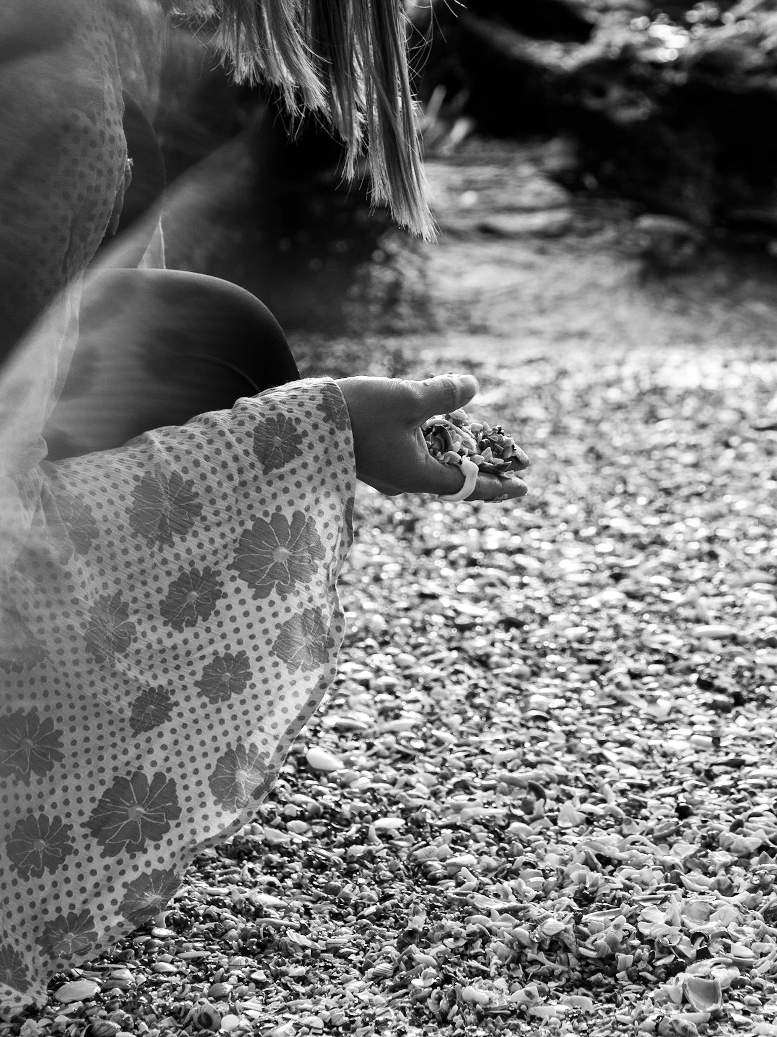 Woman at shell beach, wearing a shell ring and boho kimono in Mount Maunganui New Zealand